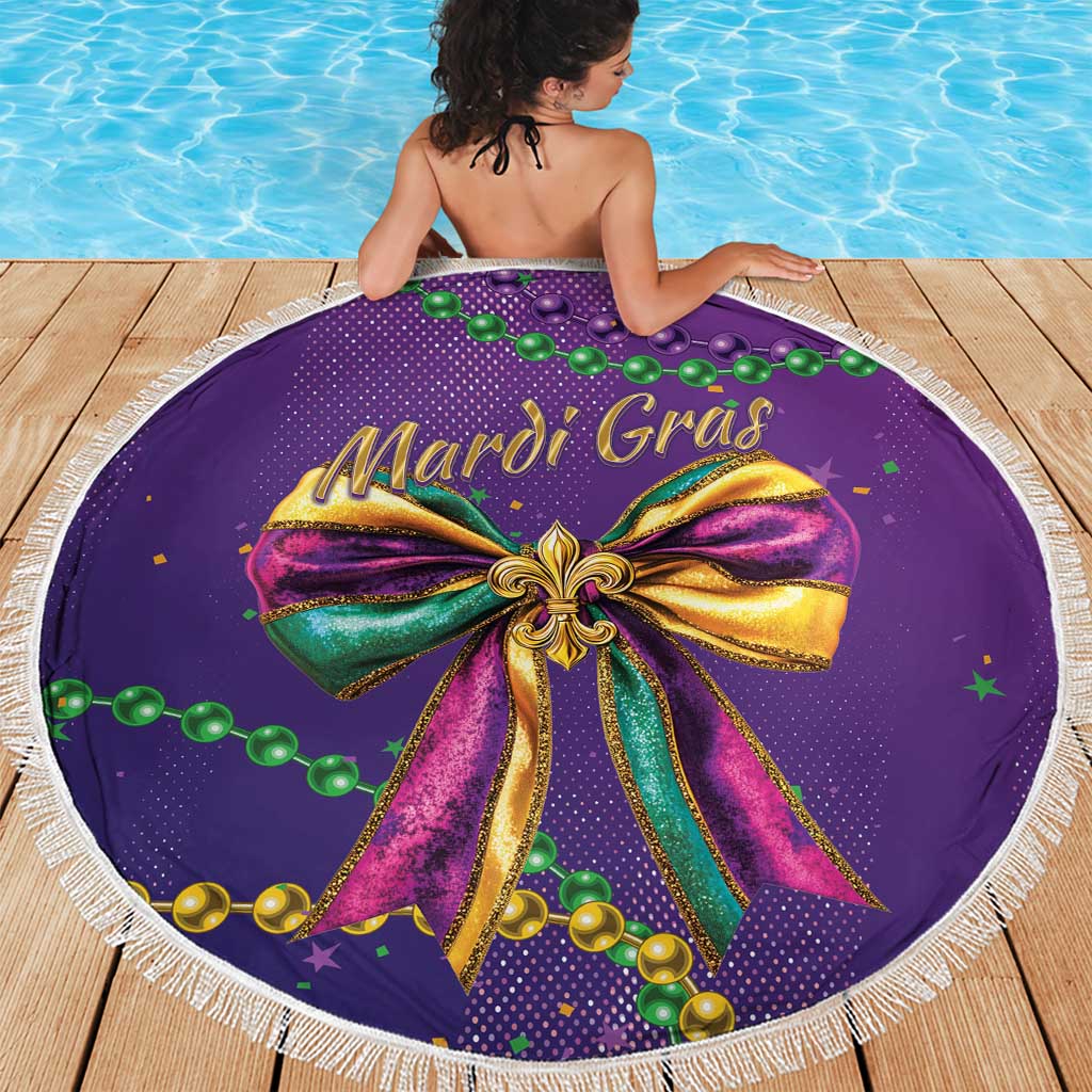 Round purple Mardi Gras beach blanket with tassel fringe, Mardi Gras bow and beaded accents.