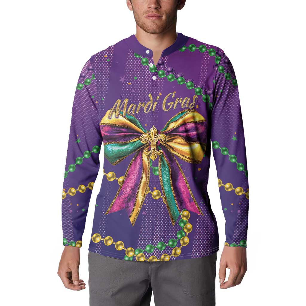 Purple button sweatshirt worn by model, Mardi Gras text and large gold ribbon bow print