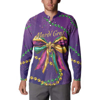 Purple button sweatshirt worn by model, Mardi Gras text and large gold ribbon bow print