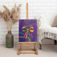 Purple canvas wall art with Mardi Gras glitter bow and green and gold beads