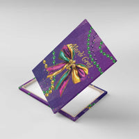 Purple canvas wall art close-up: Mardi Gras glitter bow with bead garlands