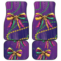 Mardi Gras car mats showing purple glitter bow with green beads and gold trim, set of 4