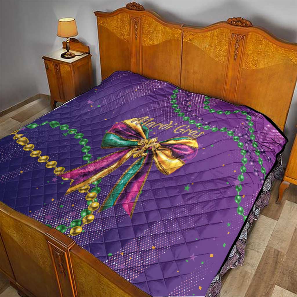 Purple quilted bedding set featuring a large Mardi Gras bow with green bead accents
