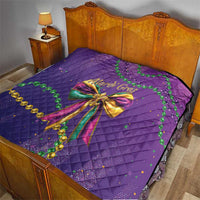 Purple quilted bedding set featuring a large Mardi Gras bow with green bead accents