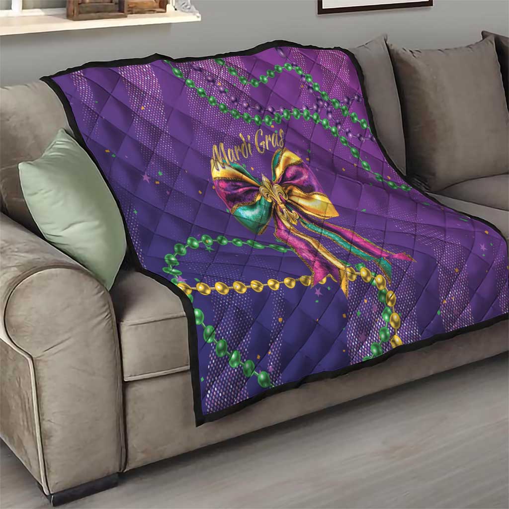 Purple quilted sofa throw with Mardi Gras bow design and green beads with gold trim