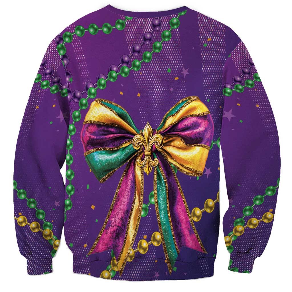 Purple sweatshirt with centered glitter bow graphic and colorful bead garland