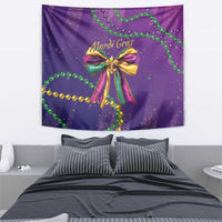 Purple Mardi Gras wall tapestry with multicolor bow and green bead garland print