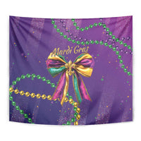 Purple Mardi Gras tapestry close-up of multicolor bow and green bead garlands