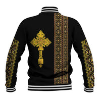 Black baseball jacket back with large gold cross emblem, vertical patterned stripe, ribbed hem