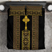 Black duvet cover with gold-and-green geometric Ethiopian motif and cross emblem