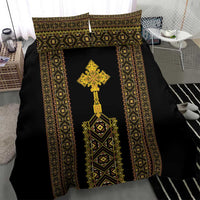 Black duvet cover with gold-and-green vertical panels and large central cross design