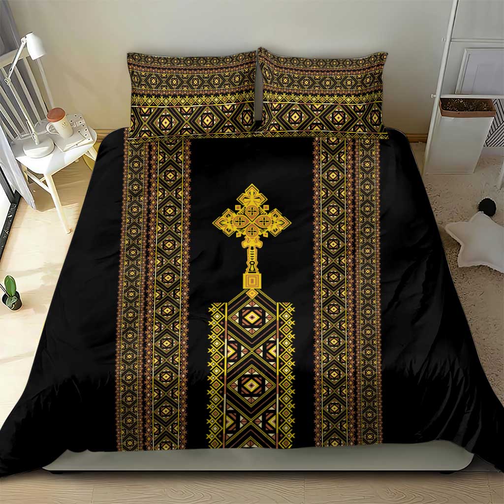 Black duvet cover with gold-and-green border motifs, central cross, and matching pillow shams