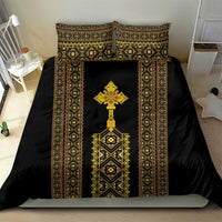 Black duvet cover with gold-and-green border motifs, central cross, and matching pillow shams