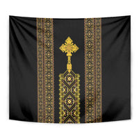 Black tapestry close-up with gold center cross and patterned vertical bands.