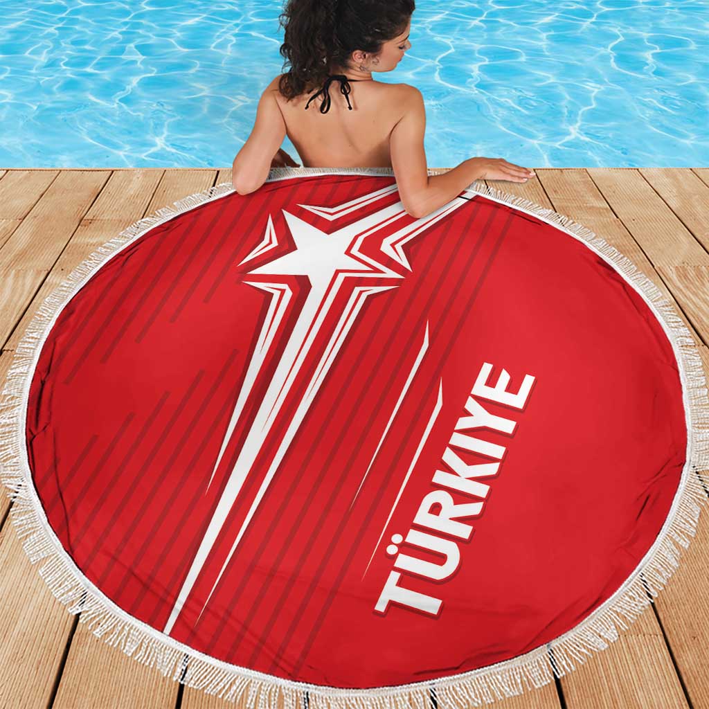 Red round Turkey beach blanket with large star-and-stripe center graphic, fringed edge