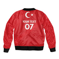 Red satin bomber jacket with black ribbed hem and back crescent moon with custom text