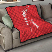 Red quilt blanket with black trim and white star graphic