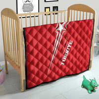 Red quilt blanket with Turkey star graphic and black trim