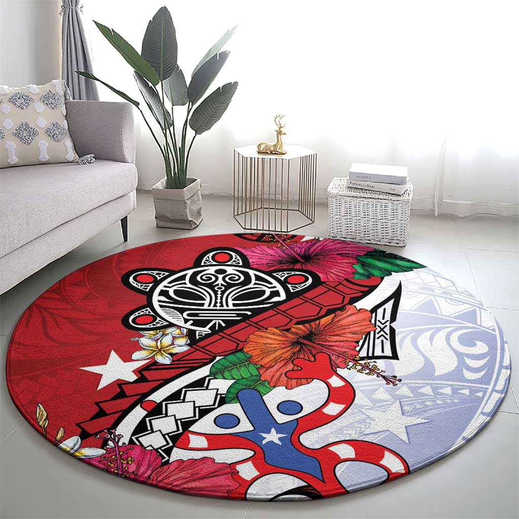 Red round rug with large black emblem, blue-and-white pattern, and tropical flower details.