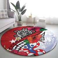 Red round rug with large black emblem, blue-and-white pattern, and tropical flower details.