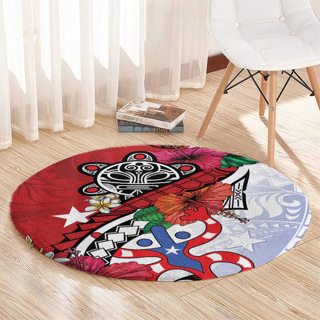 Red round rug with black tribal emblem, blue-and-white shapes, and hibiscus-style flowers.
