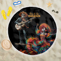 Round black Dia de los Muertos beach blanket with white fringe, skeleton guitarist and dancer