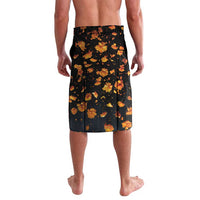 Black knee-length printed shorts with scattered orange floral motif