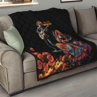 Black diamond-quilted sofa throw with Dia de los Muertos skeleton musician and dancer