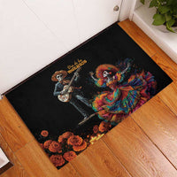 Black rubber doormat with Dia de los Muertos guitar skeleton and dancing Catrina