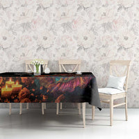 Black Dia de los Muertos tablecloth with colorful candlelit figures across dresser table