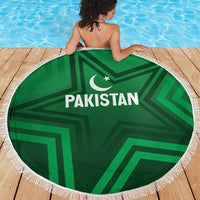 Green round beach blanket with Pakistan text, star-and-crescent graphic, white fringe trim