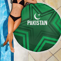Green round beach blanket with Pakistan text and crescent-star logo, white fringe trim