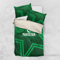 Green duvet bedding set with Pakistan logo, crescent star, and geometric panel pattern