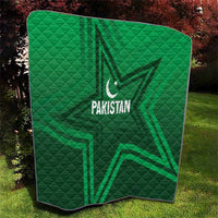 Green Pakistan quilt blanket with large star and Pakistan lettering, quilted texture