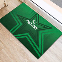 Green rubber doormat with Pakistan star logo, angled view