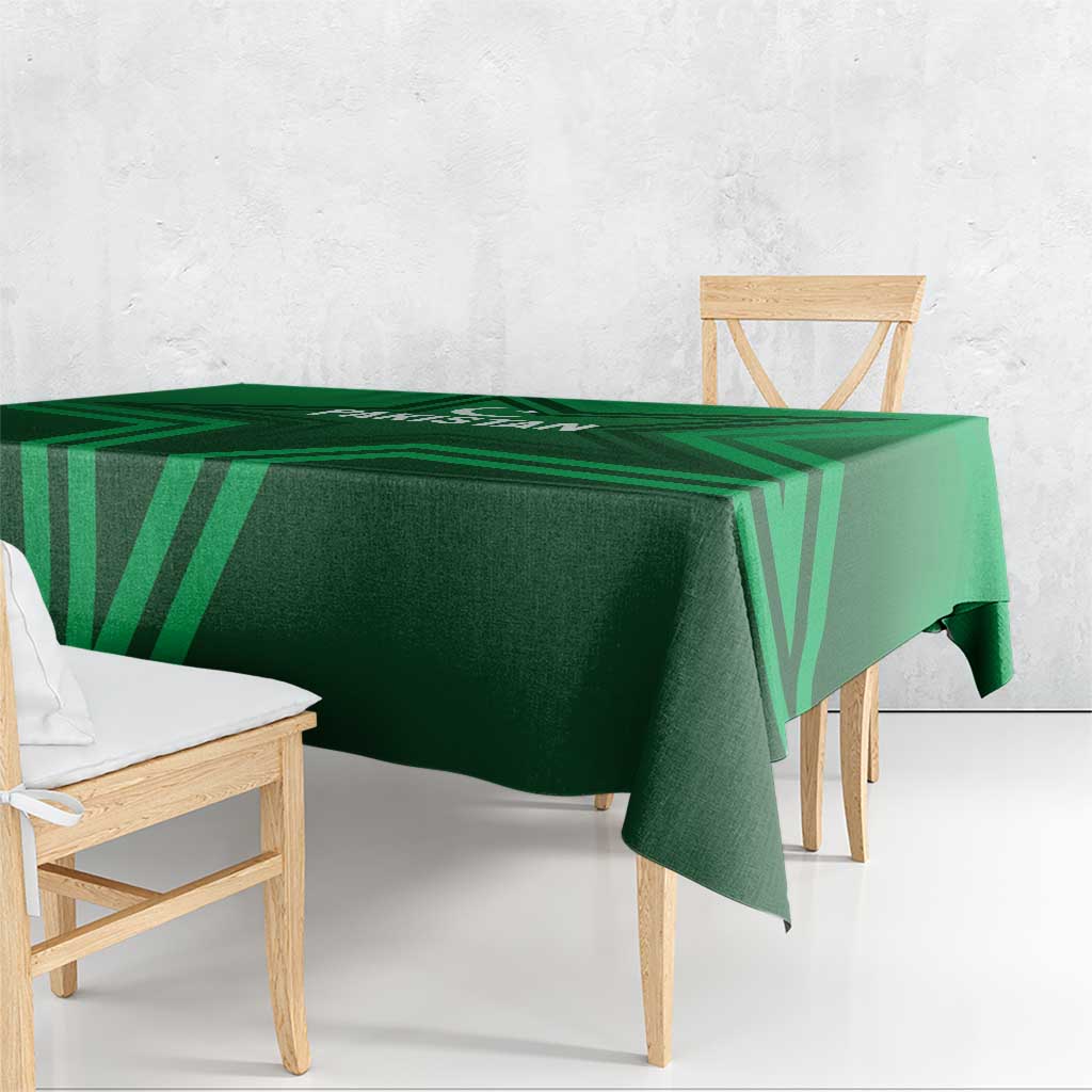 Green geometric Pakistan tablecloth draped over table, folded corner