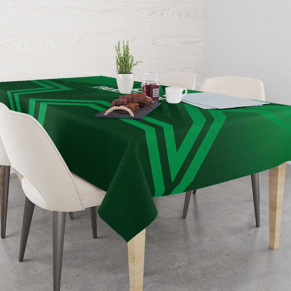 Green Pakistan tablecloth with bold chevron stripes across dining table