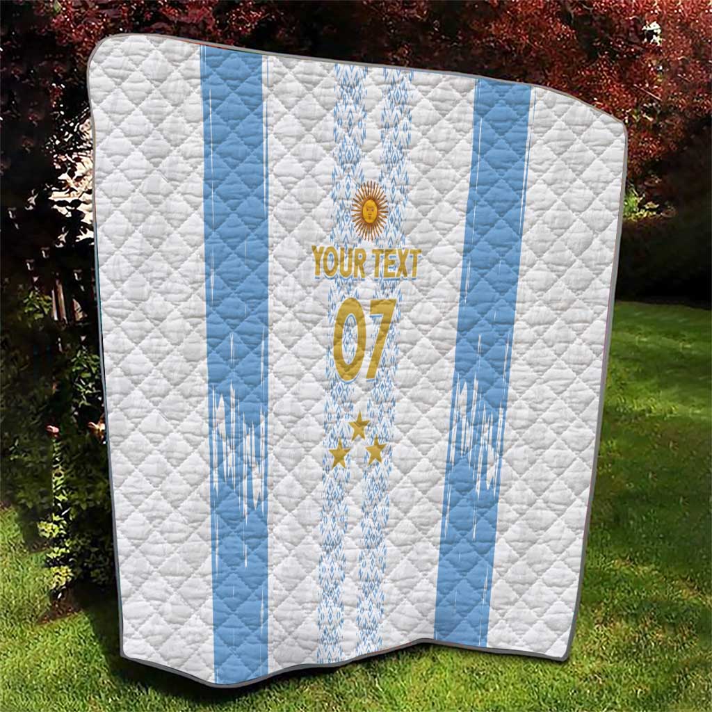 Folded white quilt with light-blue stripes, central crest and stars, “07” on the front.
