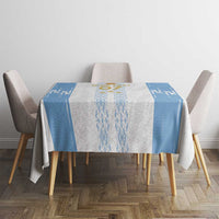 Blue-and-white custom football tablecloth on round dining table with emblem and side panels