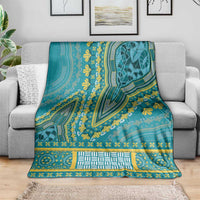 Teal dashiki blanket with yellow vine-like prints, patterned center block, and border