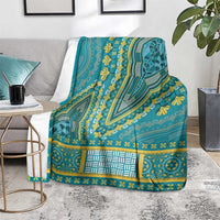 Teal patterned throw blanket with yellow motifs and central geometric rectangle panel