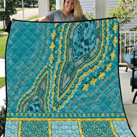 Teal dashiki-style quilt with yellow floral accents and patterned border