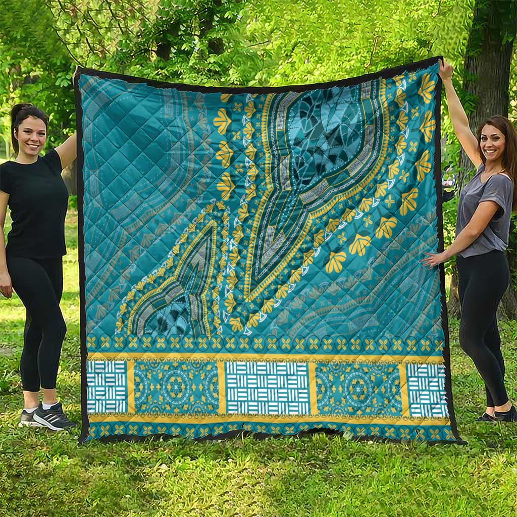 Teal dashiki-style quilt with yellow floral motifs and decorative geometric border