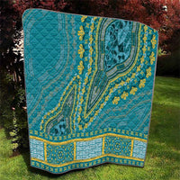 Teal dashiki-style quilt with central medallion, yellow floral trim, and border