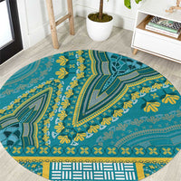 Round teal patterned carpet with yellow motifs and tribal border, circular design