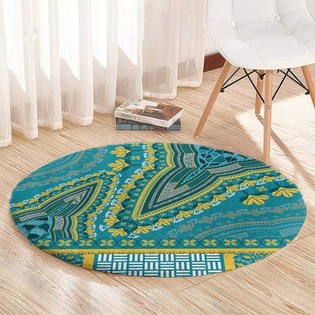 Round teal decorative carpet with yellow leaf and wave patterns, centered tribal medallion