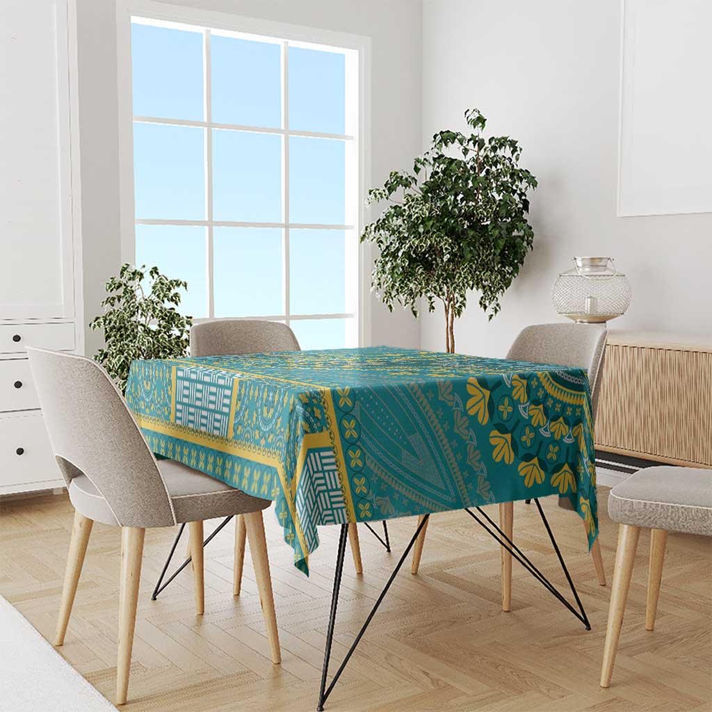 Teal dashiki tablecloth with yellow and white geometric bands on dining table