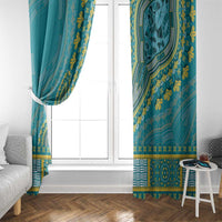 Teal dashiki window curtains with gold leaf print and patterned hem at floor length.