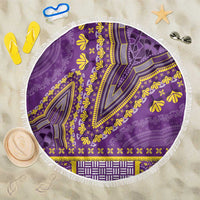 Purple round beach blanket with white fringe and yellow dashiki pattern