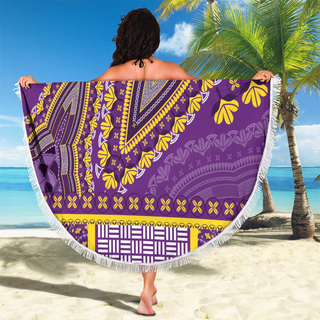 Purple round beach blanket with white fringe and yellow dashiki pattern, draped
